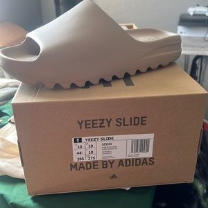 Yeezy slide pure size 10. Dead stock with proof of purchase. Too small 4 me